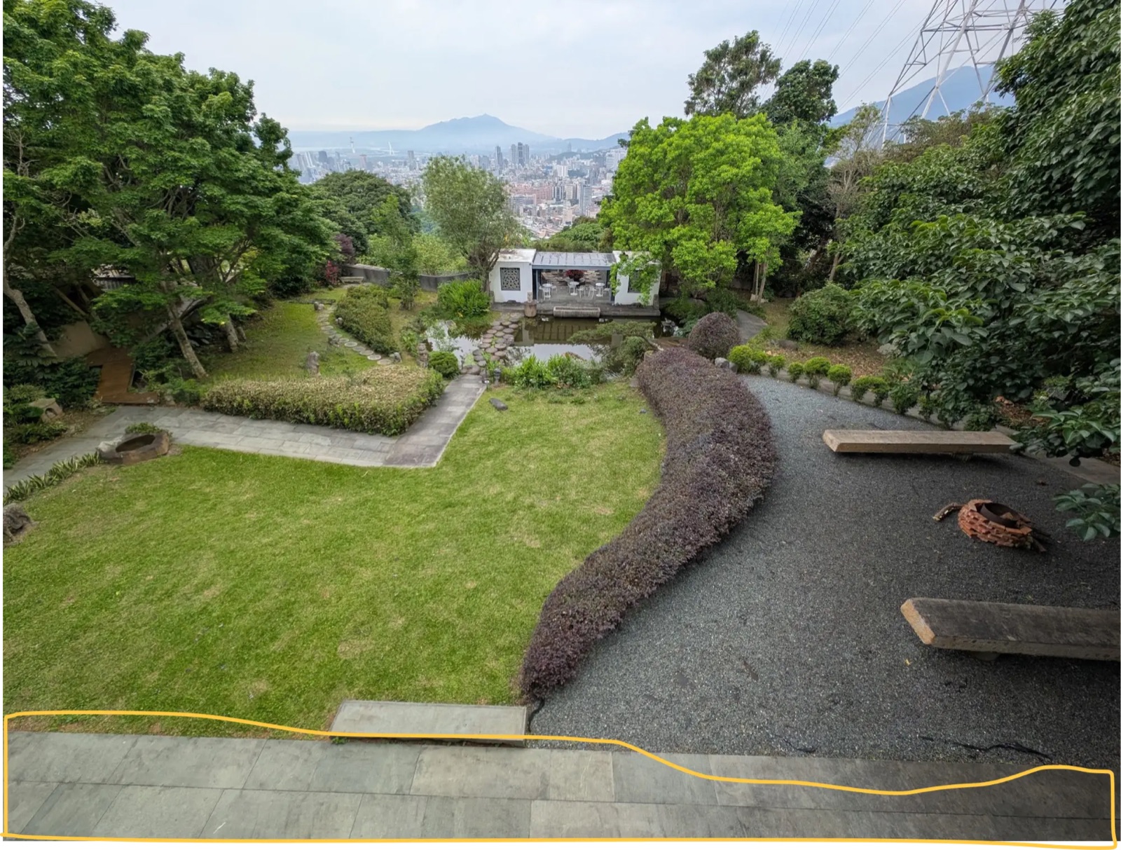 The garden from the terrace outside the 1st floor, with the pond and Taipei skyline
